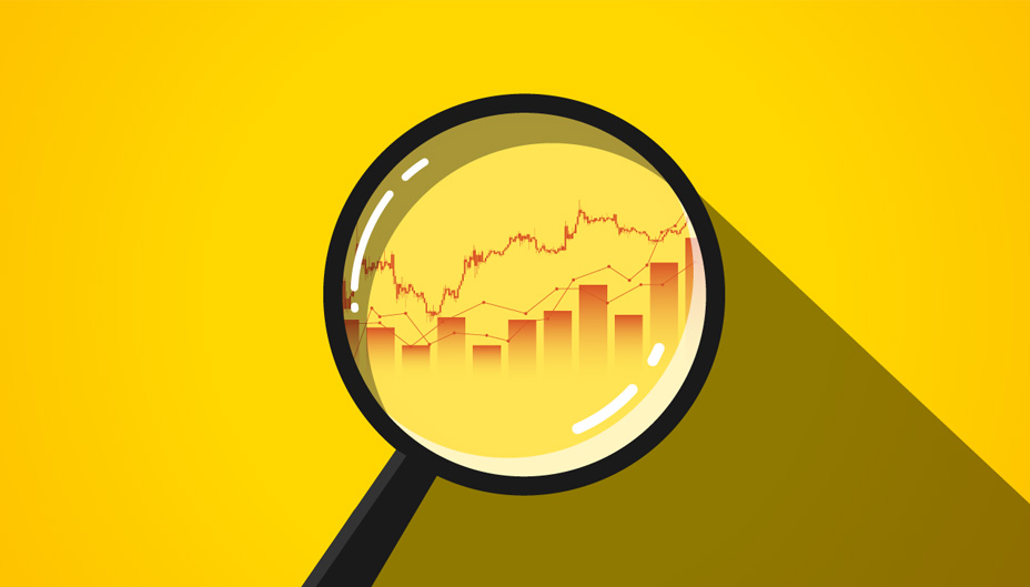 Magnifying glass revealing charts and graphs over  a yellow background