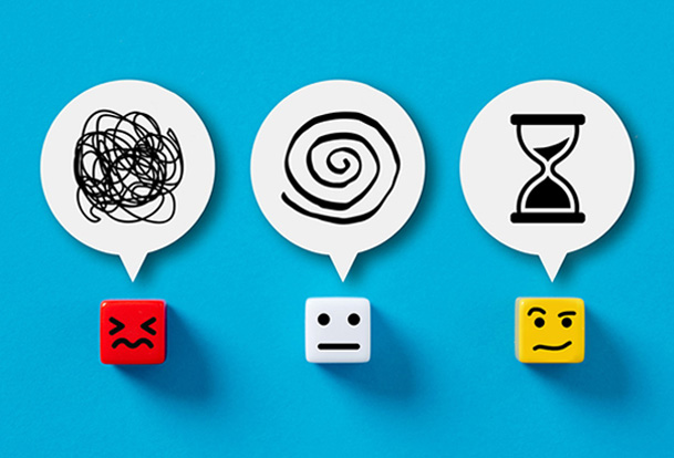 Three dice with stressed, neutral and thoughtful faces and a thought bubble above each