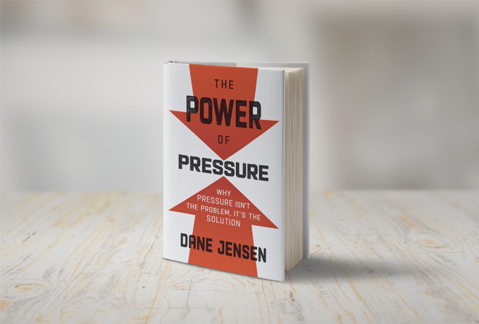 A photograph of Dane Jensen's book "The Power of Pressure"