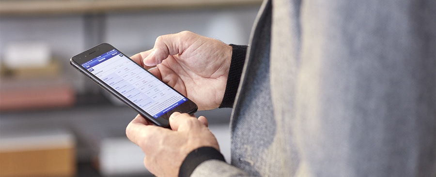 Person looking at a watchlist on the RBC mobile app. 