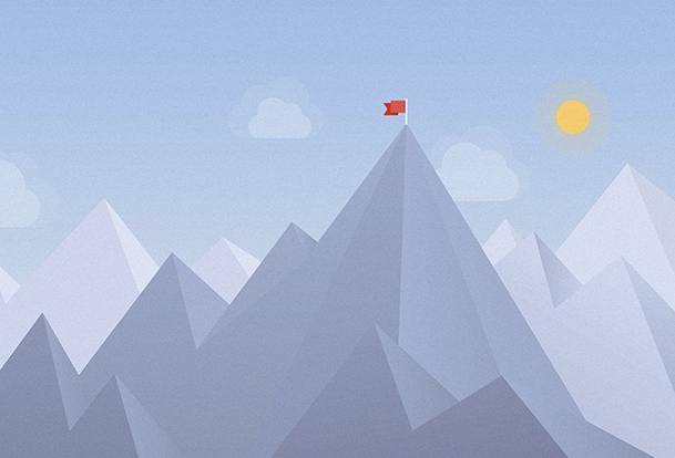 Mountain range with a flag on the tallest peak.