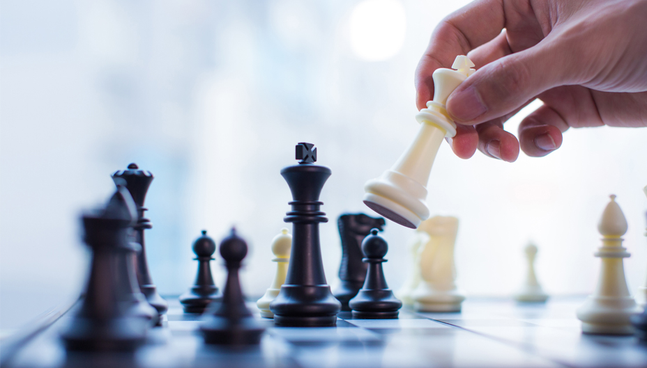 A close-up photograph of a chess game being played.