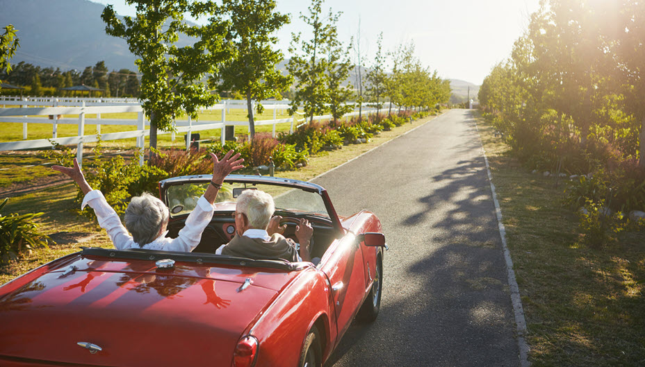 Couple driving off into the sunset. 