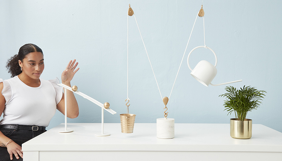 Person with a Rube Goldberg machine