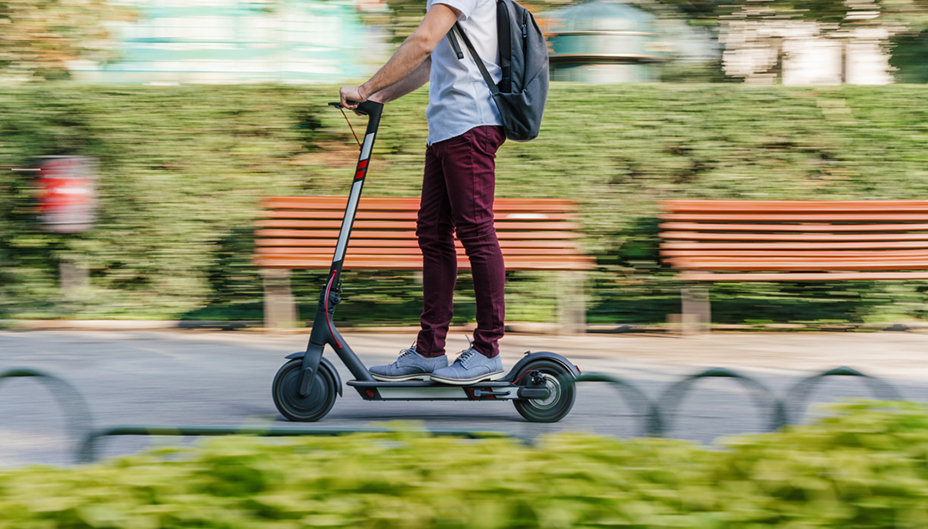 Man riding an e-scooter.