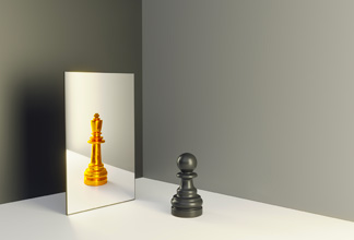 A black pawn and a gold king chess piece