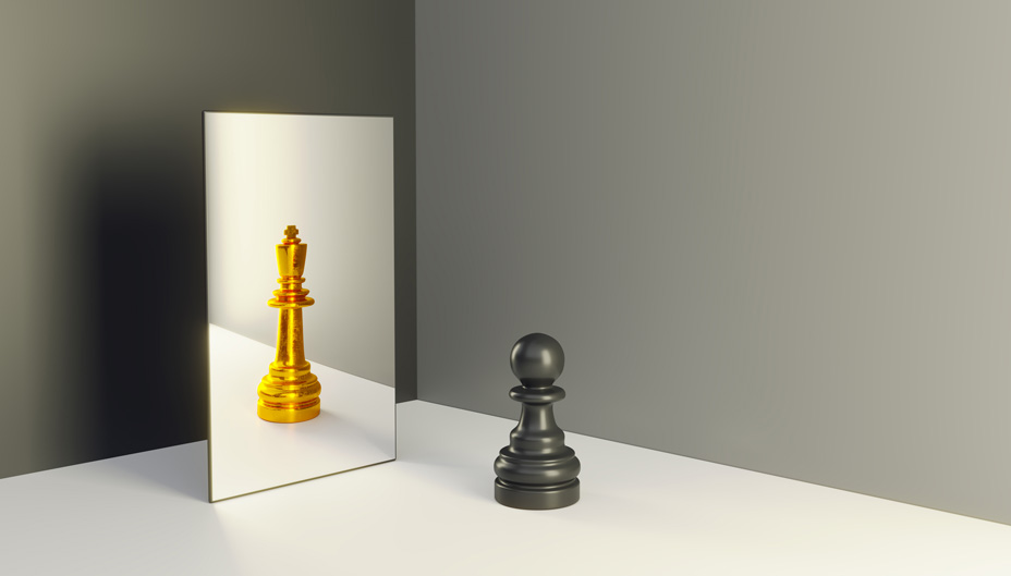 A black pawn and a gold king chess piece